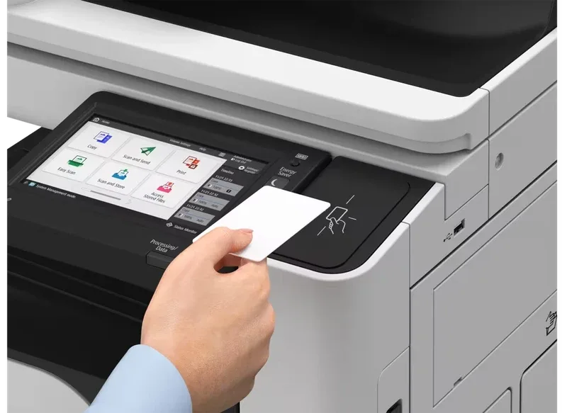 Person tapping an ID card on the Canon imageFORCE C3026 touch control panel